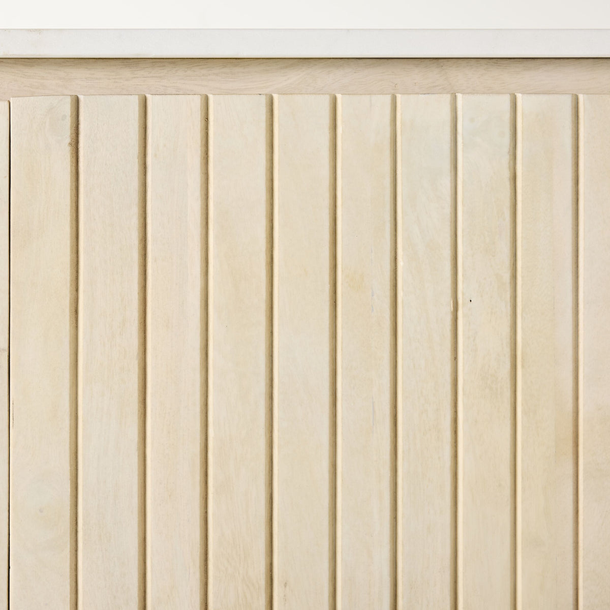Vertical white-washed mango wood slats with slim gaps sit beneath a smooth marble top, enhancing the elegance of the Deva 4 Door Buffet 170 x 80 x 43cm.