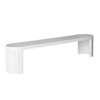 Discover the Ripple Curved Outdoor Dining Bench, a sleek white bench with rounded edges and ribbed cylindrical supports, ideal for enhancing your contemporary outdoor furniture.
