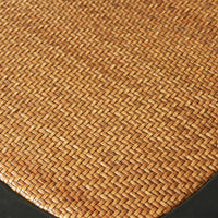 A close-up of the woven rattan texture in a basket pattern with a black border, similar to the intricate design seen on a Provincial Cross Back Dining Chair Black, reminiscent of classic Paris cafe style.