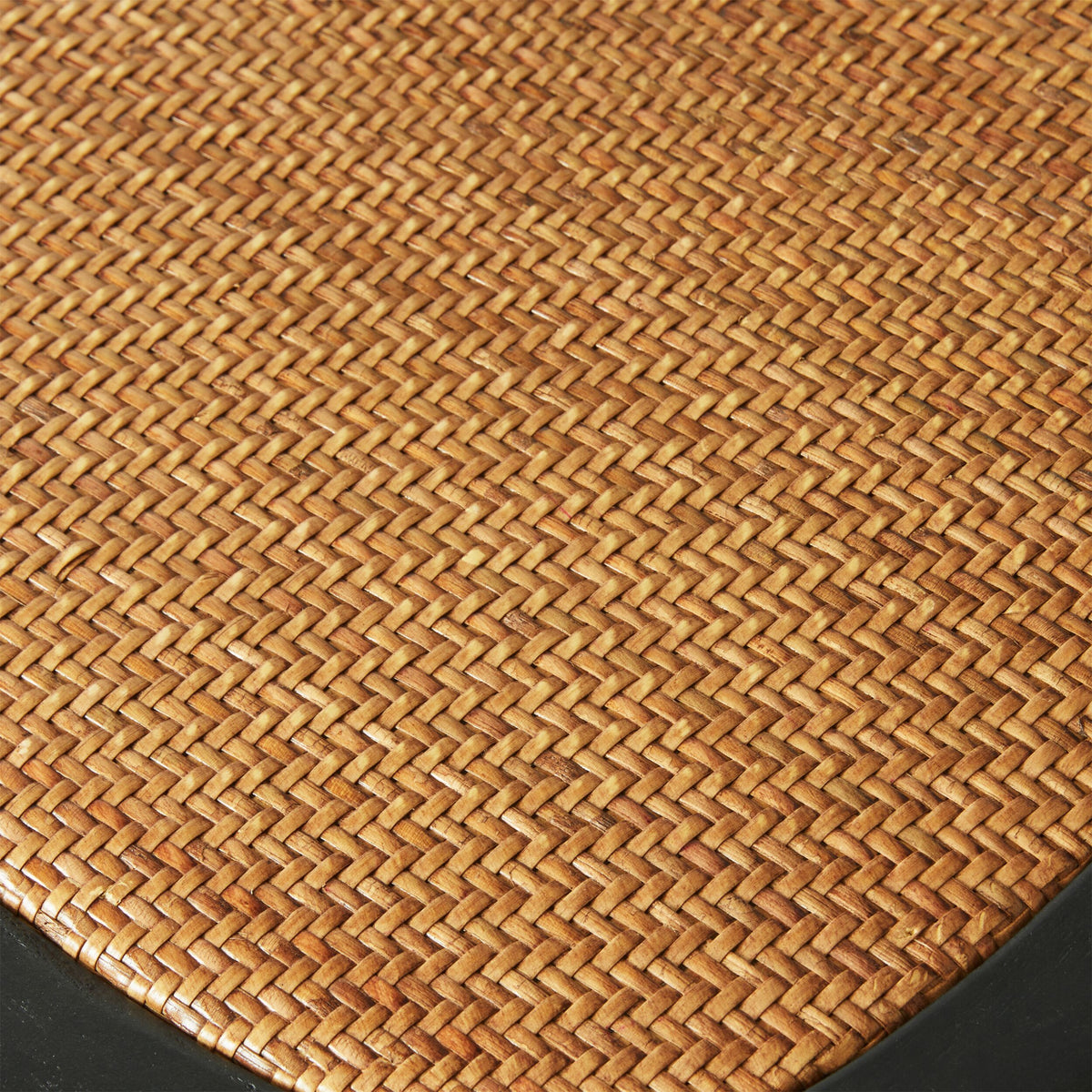 A close-up of the woven rattan texture in a basket pattern with a black border, similar to the intricate design seen on a Provincial Cross Back Dining Chair Black, reminiscent of classic Paris cafe style.