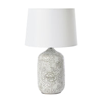 The Natural Hues Floral Table Lamp 61cm features a porcelain base with an elegant floral design in soft gray and comes with a white shade.
