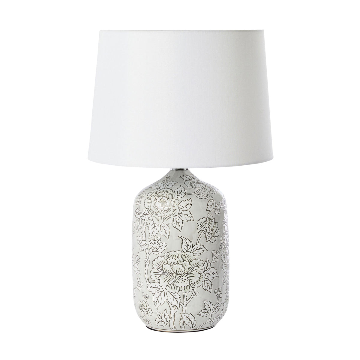 The Natural Hues Floral Table Lamp 61cm features a porcelain base with an elegant floral design in soft gray and comes with a white shade.