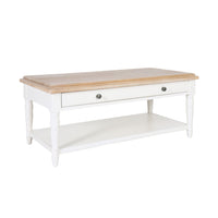 The Clover 1 Drawer Timber Coffee Table has a light wood top, white frame, central drawer with two knobs, and a lower open shelf—an elegant addition to any living space.