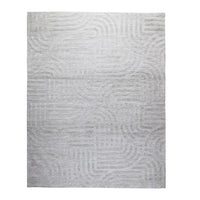 The Tufted Teal Jules Rug 300x240cm features a subtle geometric pattern of curved and straight lines, bringing understated Mid-Century style to any space.