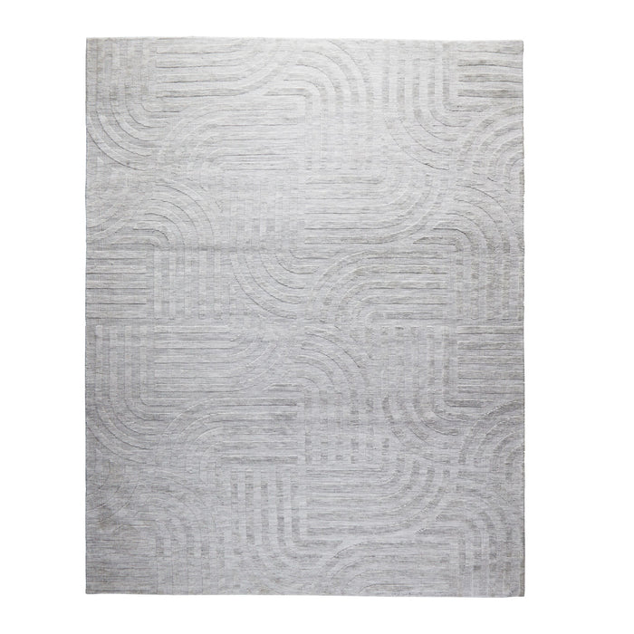 The Tufted Teal Jules Rug 300x240cm features a subtle geometric pattern of curved and straight lines, bringing understated Mid-Century style to any space.