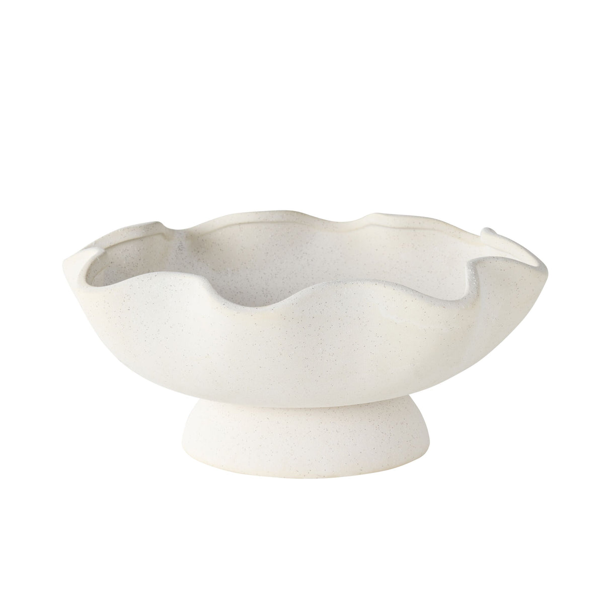 The Tranquil Wavy Pedestal Bowl features a white sand clay finish, wavy scalloped edge, and short pedestal base, making it a charming decorative centrepiece against a plain background.