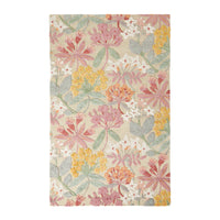 Introducing the Botanic Native Rug 240x150cm: a hand-tufted, rectangular masterpiece made from 100% wool, featuring a stunning floral design with pink, yellow, white flowers and lush green leaves on a soothing beige background.