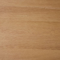 Close-up view of a light brown wooden surface with visible grain patterns and a smooth finish, similar to the craftsmanship of the Spintara 4 Drawer Chest Light Oak.